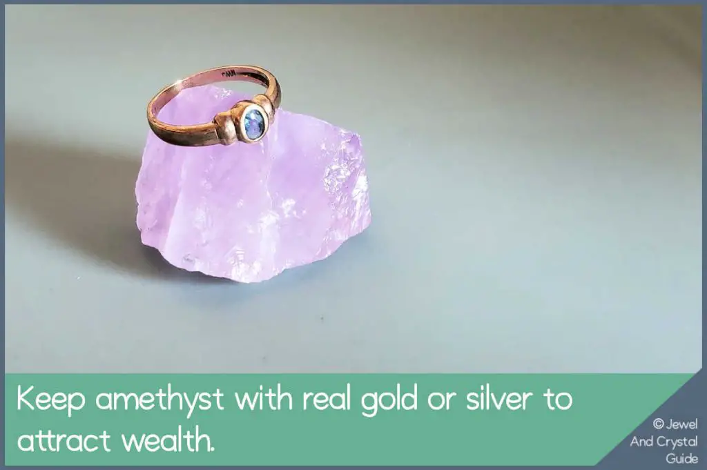 Photo of a gold ring on an amethyst stone