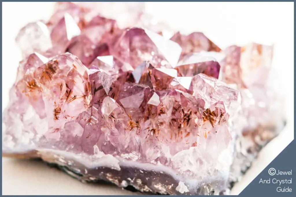 Close up photo of pink amethyst rough raw druzy