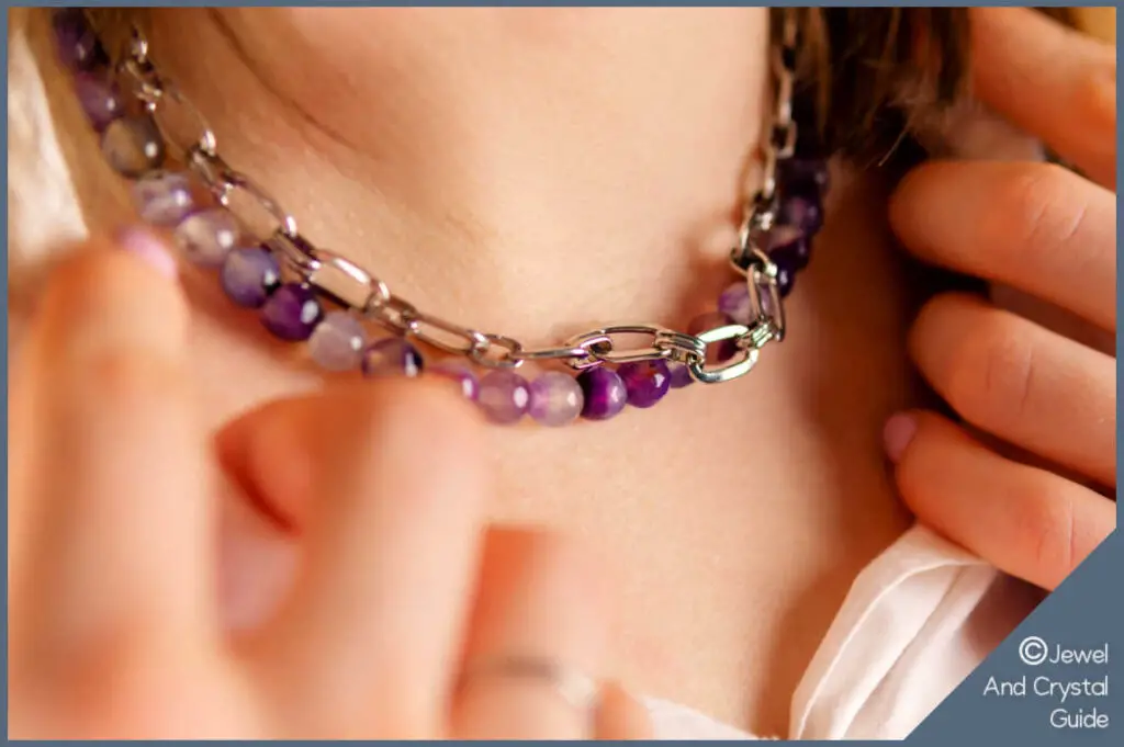 Women wearing a necklace with amethyst beads