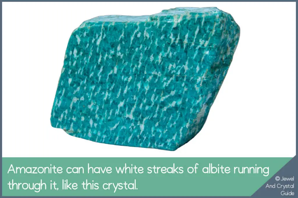 Photo of a green amazonite crystal with white streaks of albite running through it